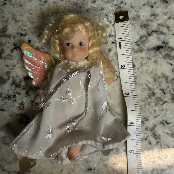Porcelain Angel Doll with Golden Hair and Iridescent Wings - Picture 6 of 6
